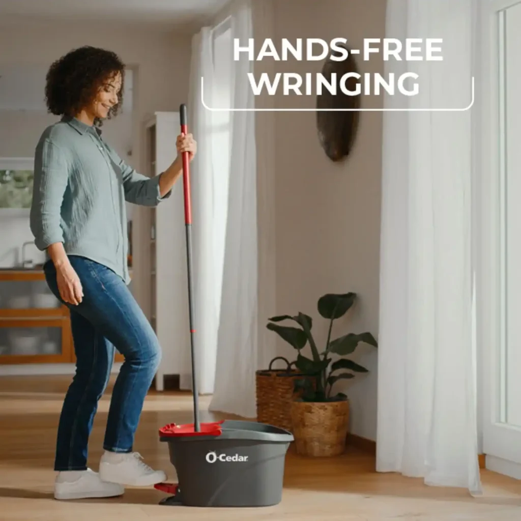 Hands-free wringing demonstration using the O-Cedar foot pedal system on a hardwood floor.